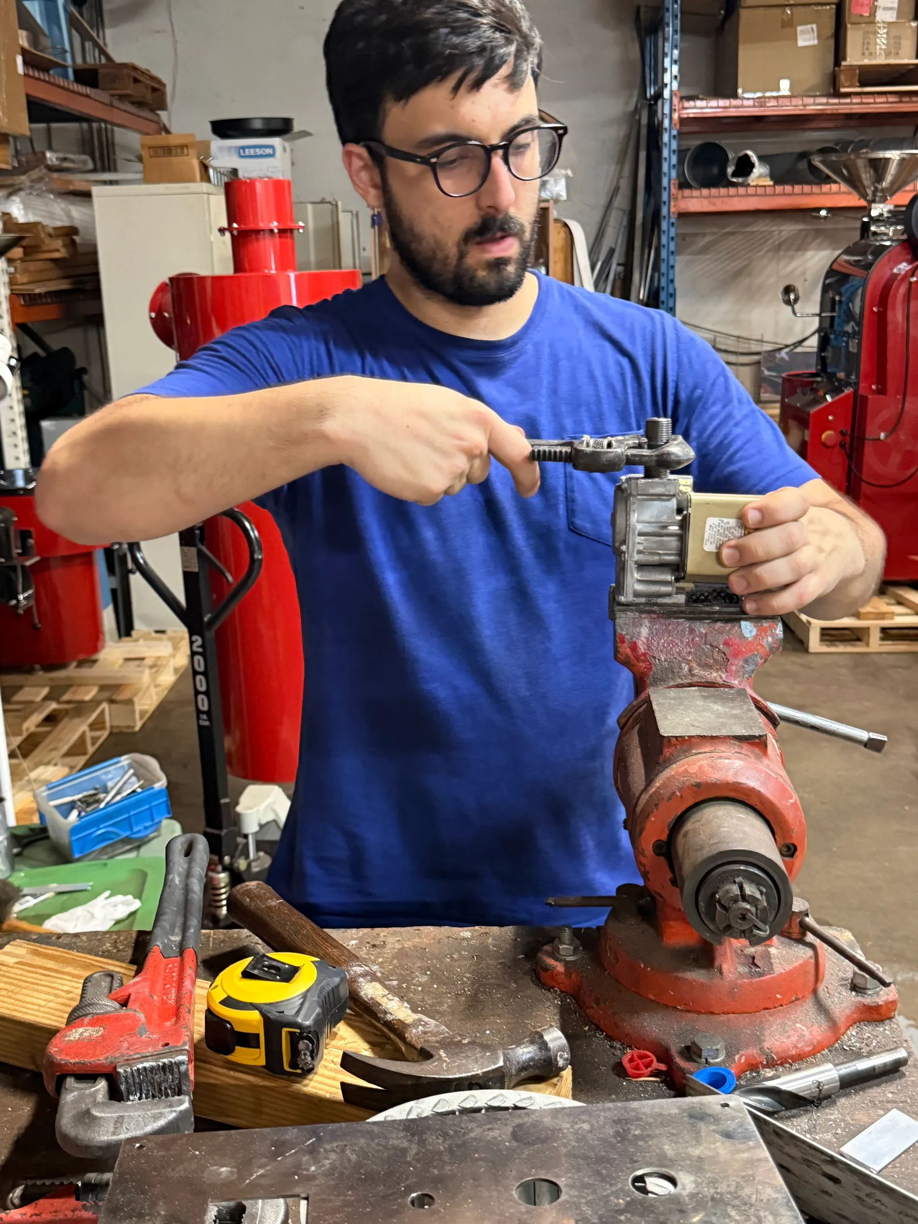 Nedim at the bench, fitting a gas control.